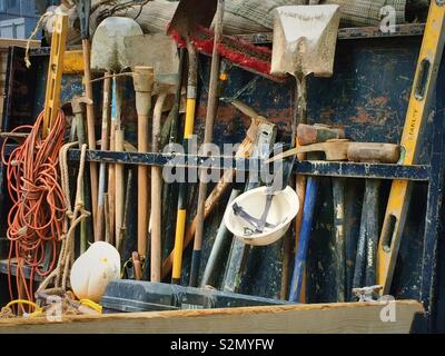 Tools and shovels in a rack on the back of a truck, USA Stock Photo