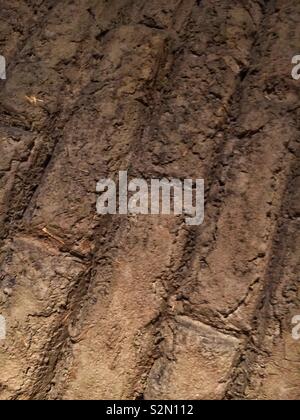 Clay mud bricks packed, dried, and strong as a wall building material. Stock Photo