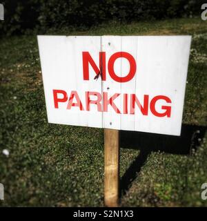 No parking sign on grass Stock Photo