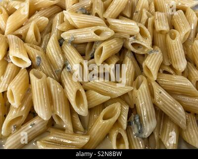 Penne Rigate pasta with gorgonzola sauce Stock Photo