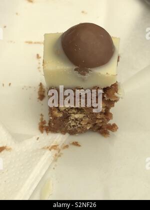 Small mouthful of Malteser tray bake cake Stock Photo