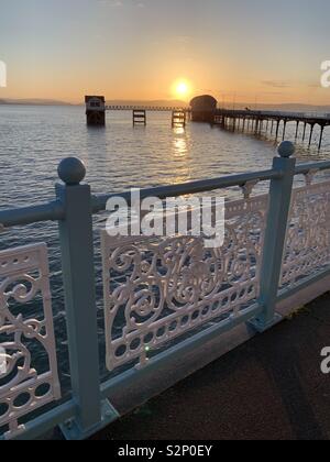 Sunrise over mumbles pier Stock Photo