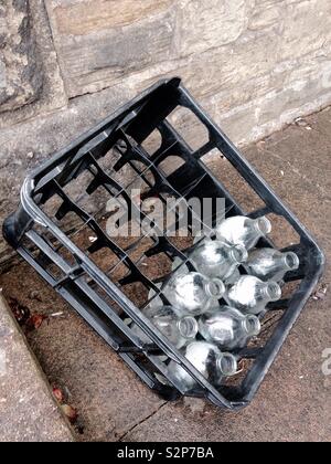 Glass Milk Bottles in a Plastic Crate Stock Photo