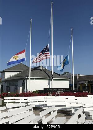 Rehoboth Beach, Delaware flys flags at half mast honoring those killed by gun violence in Virginia Beach, Virginia. Stock Photo