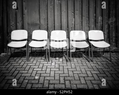 5 empty chairs Stock Photo