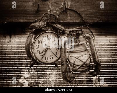 old clock and broken lantern Stock Photo