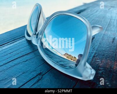 Beach reflection in sunglasses.