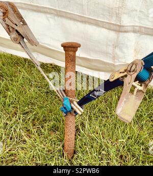 Marquee Guy Ropes Marquee tent stake with ratchet strap and base plate Stock Photo - Alamy