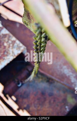 Chain on an antique John Deer tractor Stock Photo