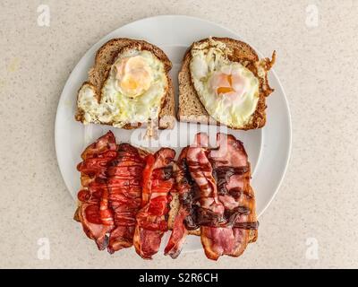 Egg and bacon sandwich on wholemeal brown bread Stock Photo