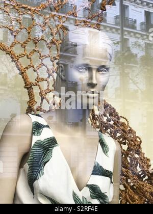 Mannequin in a shop window. Stock Photo