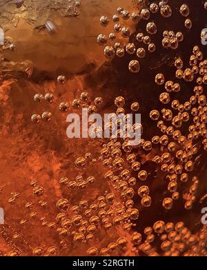 Abstract of water drops on a glass that looks like gold beads Stock Photo
