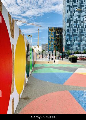 London, UK - 5th July 2019: Multi coloured approach to the O2 arena in Greenwich. Stock Photo