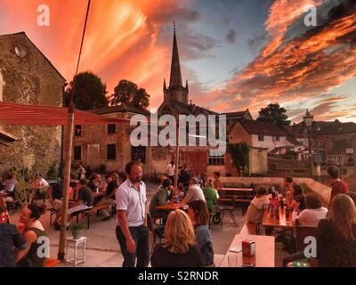 A beautiful sunset over the pop up Cantina Tapas Bar which is part of the Frome Festival, Somerset Stock Photo