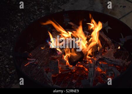Flames burning from fire pit Stock Photo