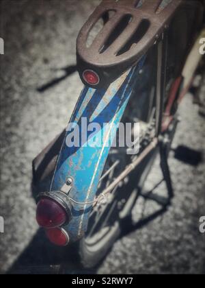 Old rusty blue Whizzer bicycle fender Stock Photo