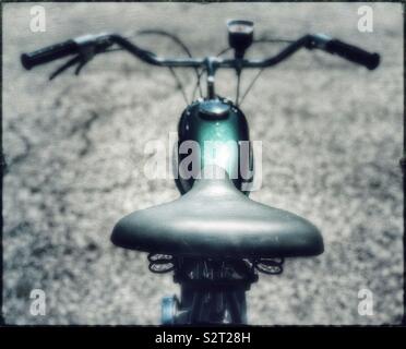 Green Whizzer motorized bicycle Stock Photo