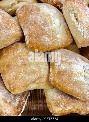 Basket full of freshly baked ciabatta bread on sale at a bakery Stock Photo