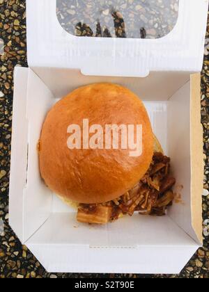 A vegan Pulled jackfruit in a brioche bun in a cardboard box Stock Photo