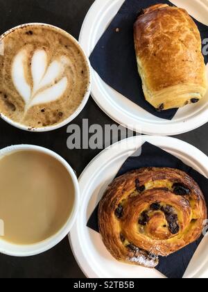 Breakfast for two people consisting of pastries, tea and coffee. Stock Photo