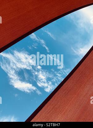 Abstract looking up at the sky through an open space in an umbrella Stock Photo