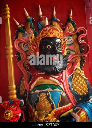 Traditional Chinese menshen, or door gods, decorate the entrance to the Tua Pek Kong Taoist Temple in the old Main Bazaar, Kuching Waterfront, Sarawak, Malaysia Stock Photo