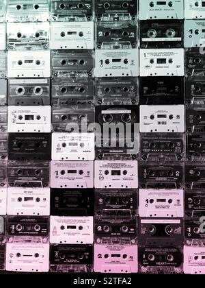 A wall covered in old cassette tapes in rows Stock Photo