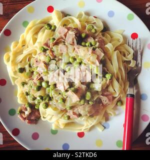 Homemade ham and pea tagliatelle. Stock Photo
