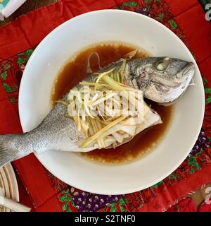 Cantonese dish: ginger spring onion steam fish Stock Photo