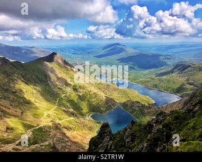 View eastwards from the peak of Snowdon over Glaslyn and Llyn Llydaw, Snowdonia (Eryri) National Park, August. Stock Photo