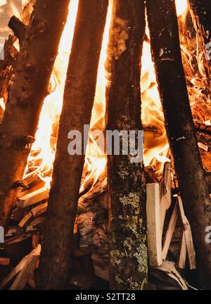Burning logs in a camp fire pit Stock Photo