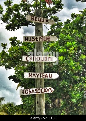 Direction Sign for Grenadine Islands on Palm Island - St.Vincent and the Grenadines Stock Photo