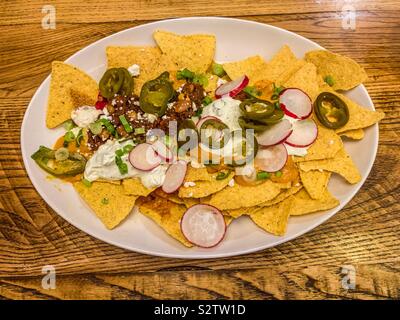 Plate of chilli beef nachos Stock Photo
