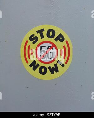 A sticker with the slogan”STOP 5G NOW!” on a mobile phone mast in Weston-super-Mare, UK Stock Photo