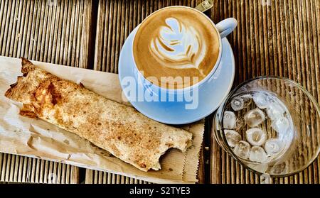 Chocolate crepe with a cup of cappuccino. Stock Photo