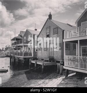 Black and white image of homes over the water on the island of Nantucket, Massachusetts, United States