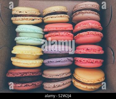 Assortment colourful fresh macarons in a paper box. Stock Photo
