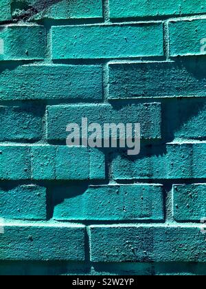 Wall of blue bricks with shadows Stock Photo