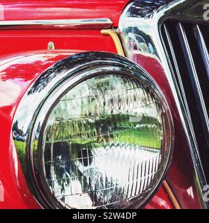Headlamp and grille of an MG sports car Stock Photo