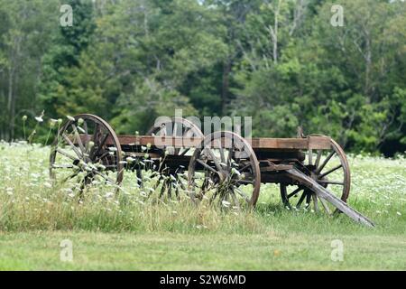 Antique hay wagon in New Boston field Stock Photo