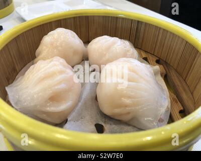 Har gow is a traditional Cantonese dumpling served in dim sum. Also known as Ha Gow, Haukau or shrimp dumpling. Stock Photo