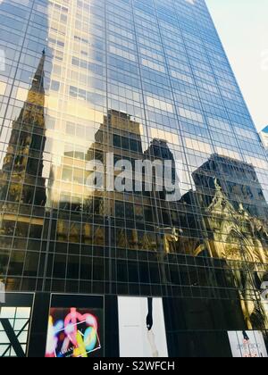 Reflection of St Patrick’s Cathedral on 5th Avenue, New York City, Manhattan Stock Photo