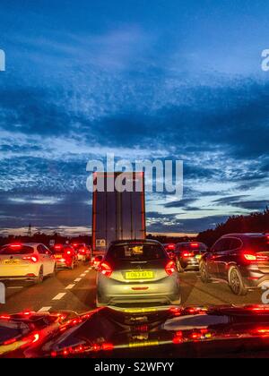 Busy traffic at dusk on M62 in West Yorkshire Stock Photo