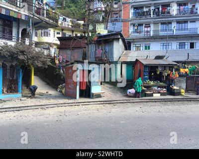 Shacks including a saloon, alongside the railway at Darjeeling in India Himalayas. Stock Photo