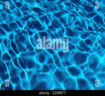 Light on the surface of an outdoor pool Stock Photo