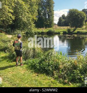 Ten year old boy fishing at Dever Springs trout fishery, Winchester,  Hampshire, England, United Kingdom Stock Photo - Alamy