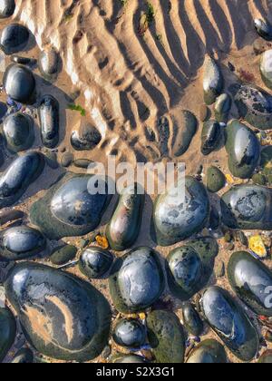 Pebbles and sand patterns Stock Photo