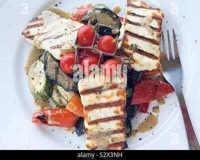 Grilled halloumi cheese with roasted vegetables Stock Photo