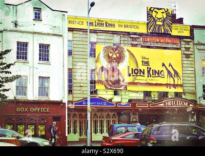 The Bristol Hippodrome and Box Office in The Centre, Bristol, UK. A large, bright advertisement for The Lion King musical is above the entrance to the venue. Stock Photo