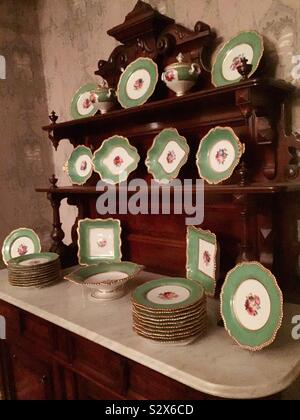Antique China hutch and set of dinnerware at the Theodore Roosevelt birthplace national historic site, New York City, United States Stock Photo